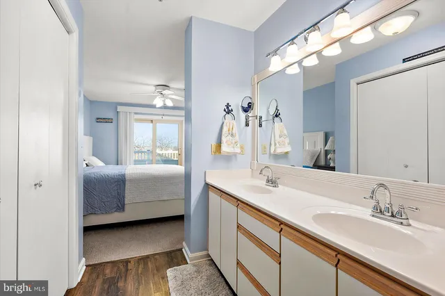 a front view of a building with a garden