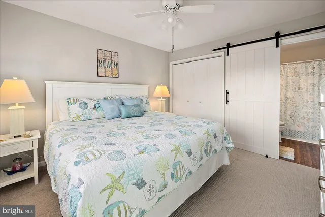 a view of a hallway with wooden floor and space