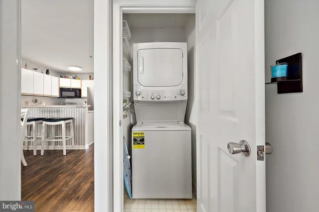 a dining room with a wooden table and chairs