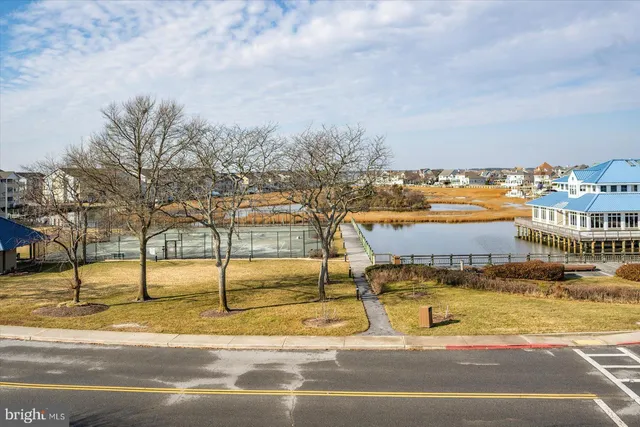 an aerial view of a house with a lake view