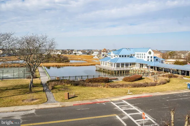 a car parked in front of a brick house