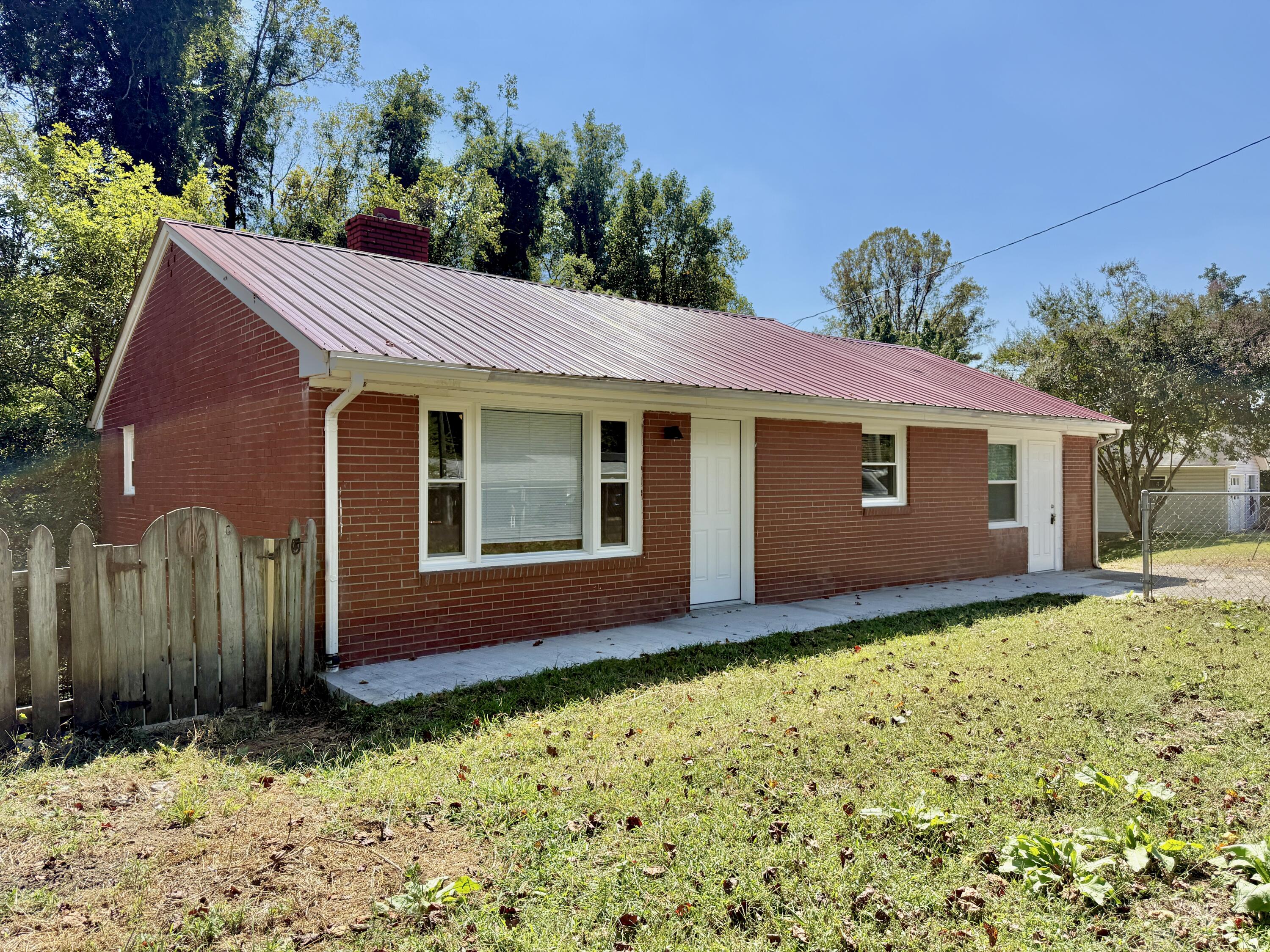 a view of house with yard