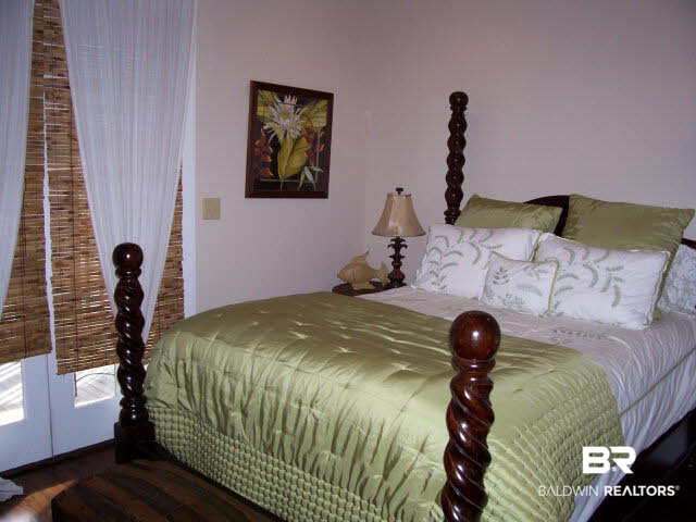 25773 Canal Road, Unit 16 Orange Beach, AL 36561 - Photo 5 of 12 Large MBR with it's own Bathroom, pls walk-out screen porch