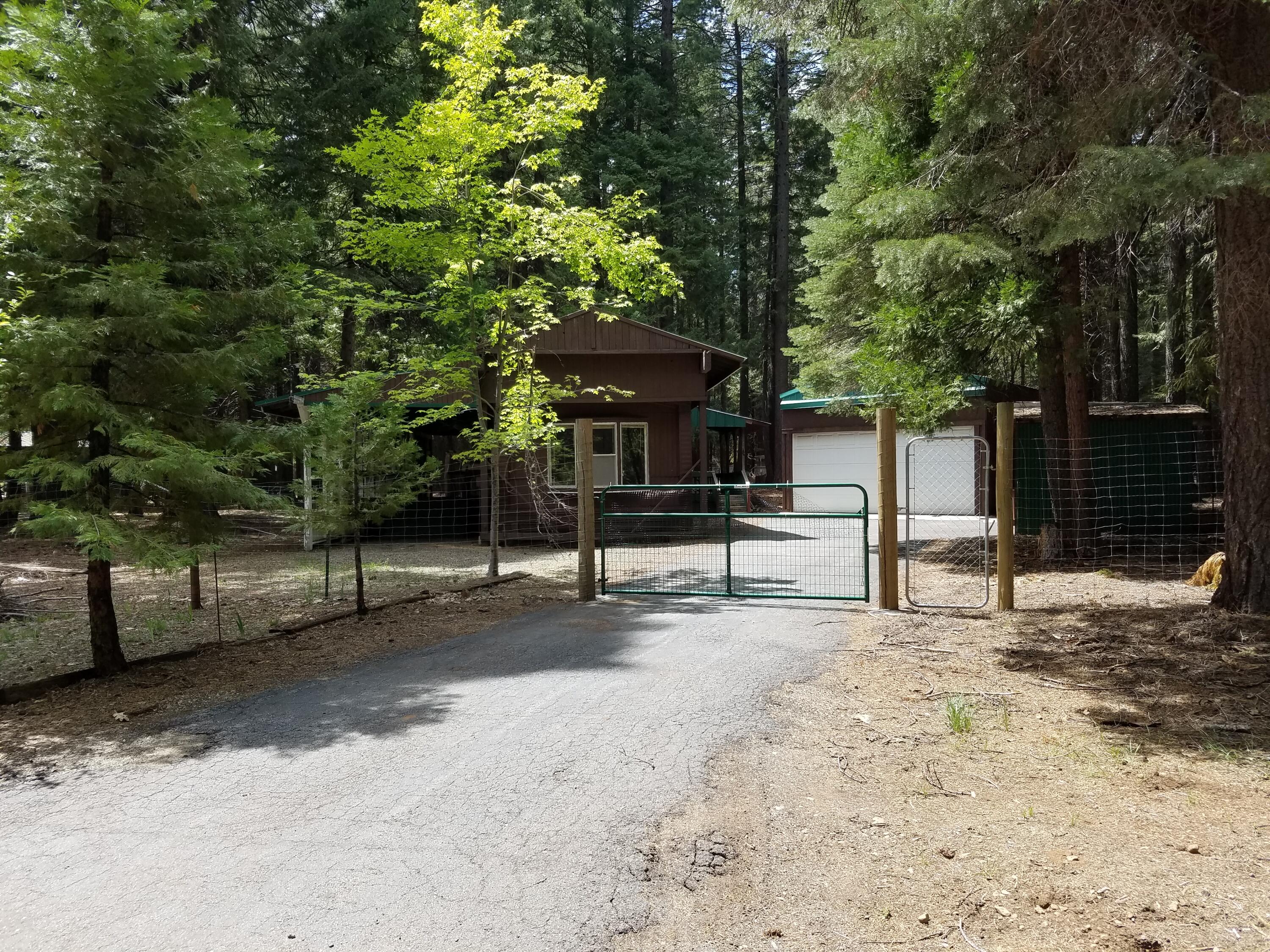 9340 Thatcher Mill Road Shingletown, CA 96088 - Photo 3 of 32 a white house that has a tree in front of it