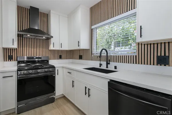 a kitchen with a stove and a sink