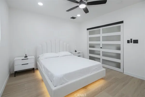 a large white bed in a white room
