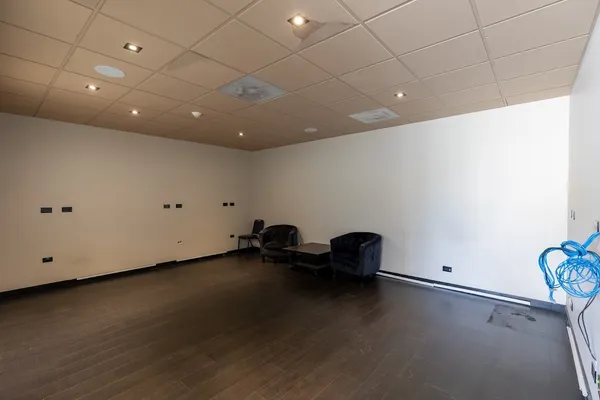 a street sign on a sidewalk next to a road