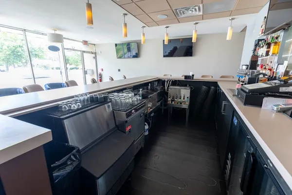 a kitchen with stainless steel appliances sink stove and cabinets