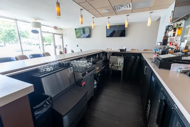 a kitchen with stainless steel appliances sink stove and cabinets