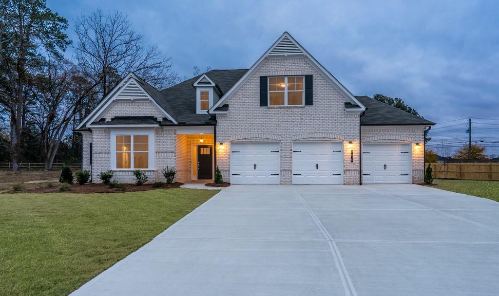 2038 Waycross Pass Southwest Marietta, GA 30064 - Photo 1 of 1 a front view of a house with a yard and trees