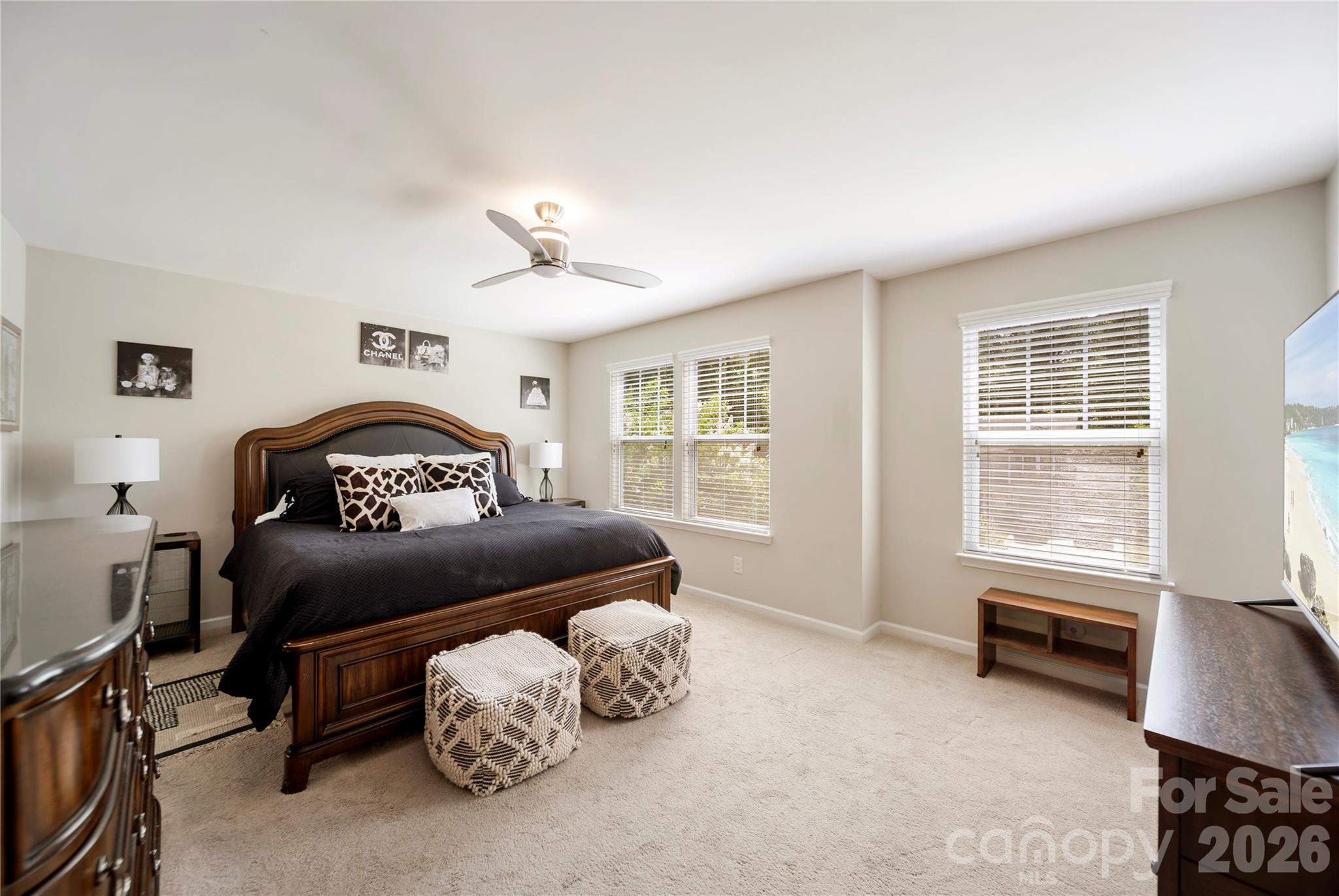 8122 Mossy Rock Road Waxhaw, NC 28173 - Photo 15 of 28 a bedroom with a bed dresser and a window
