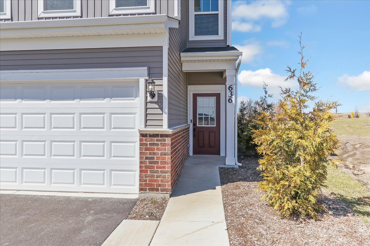 667 Switchgrass Way, Unit 62003 Bolingbrook, IL 60490 - Photo 2 of 33 a view of front door of house