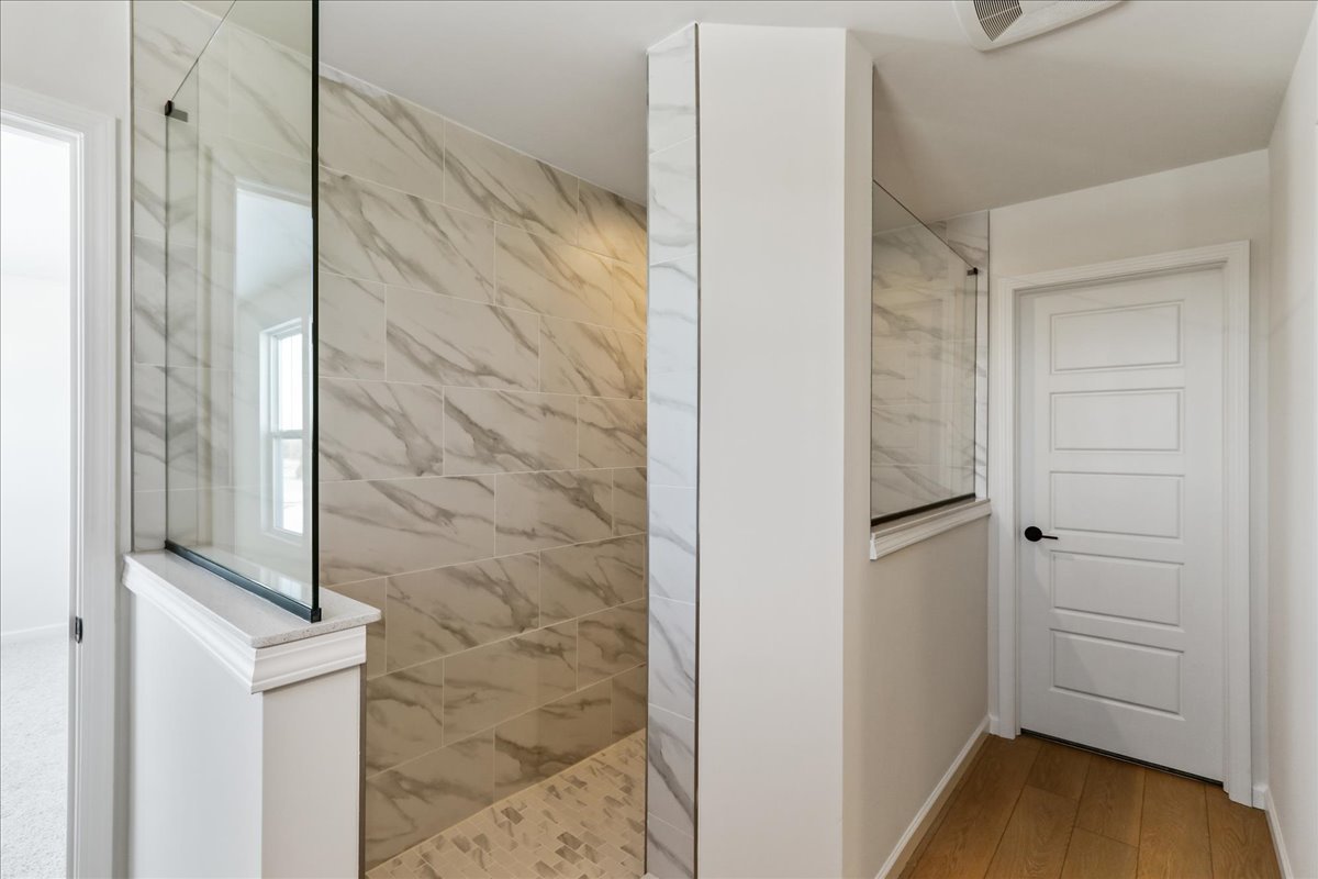 667 Switchgrass Way, Unit 62003 Bolingbrook, IL 60490 - Photo 24 of 33 a bathroom with a shower