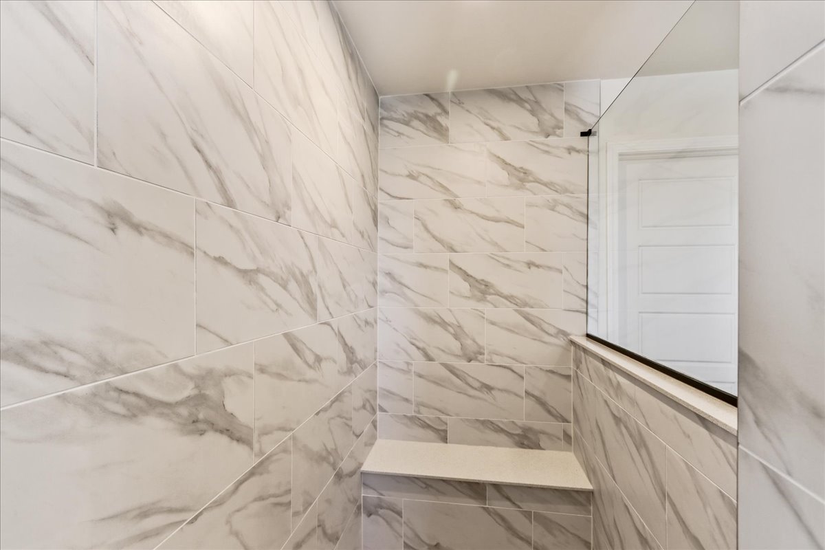 667 Switchgrass Way, Unit 62003 Bolingbrook, IL 60490 - Photo 25 of 33 a bathroom with a shower