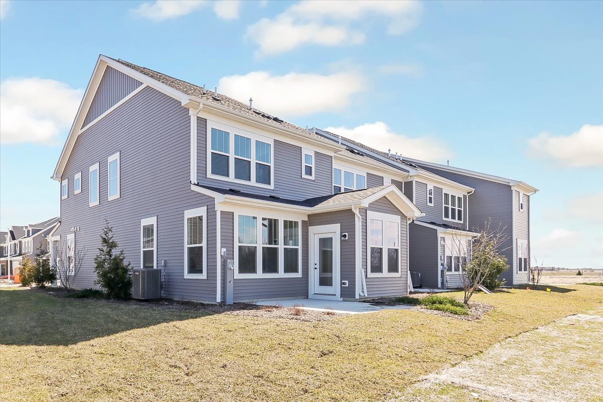 667 Switchgrass Way, Unit 62003 Bolingbrook, IL 60490 - Photo 33 of 33 a view of a house with a patio