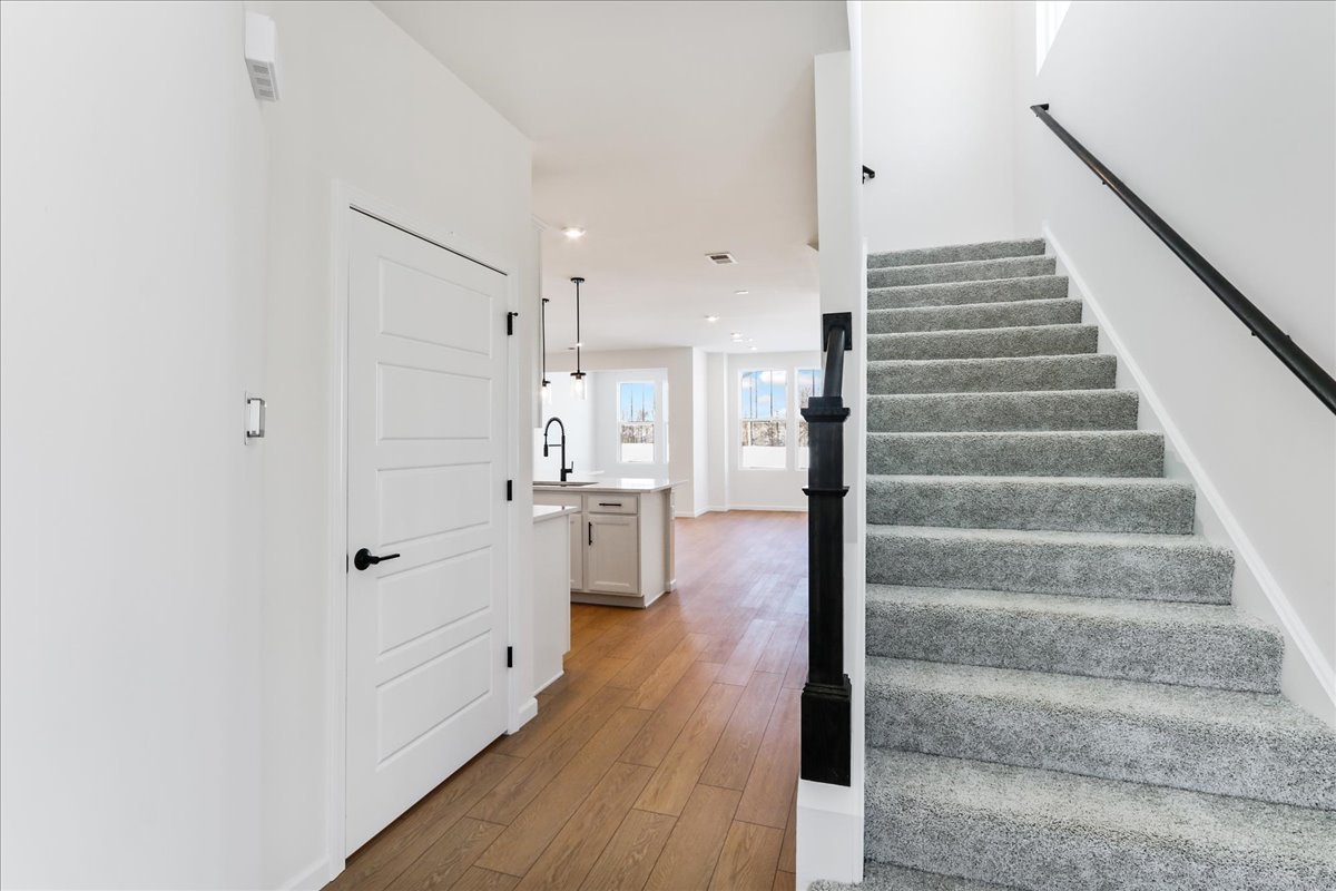 667 Switchgrass Way, Unit 62003 Bolingbrook, IL 60490 - Photo 4 of 33 a view of front door with wooden floor