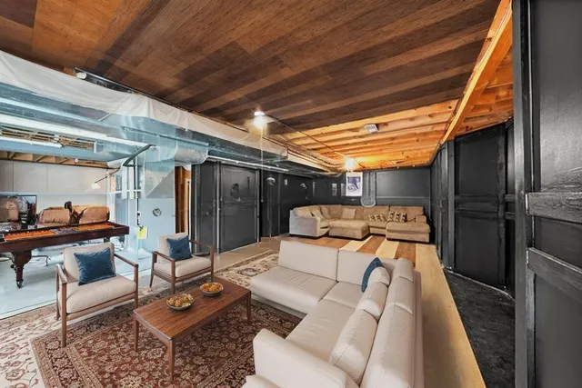 a view of a room with wooden floor