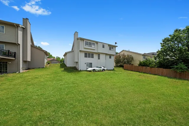a view of a house with a big yard