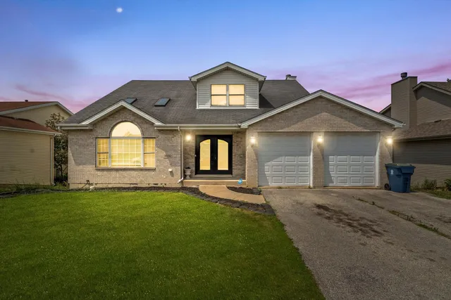 an aerial view of residential house with an outdoor space and seating