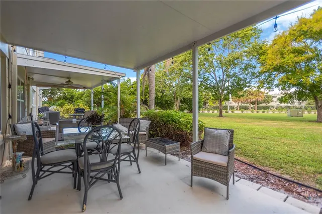 a view of a patio with chairs and table in patio