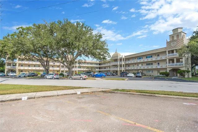a view of a swimming pool with an outdoor space and seating area
