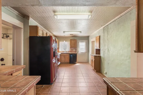 a kitchen with stainless steel appliances a refrigerator and a stove