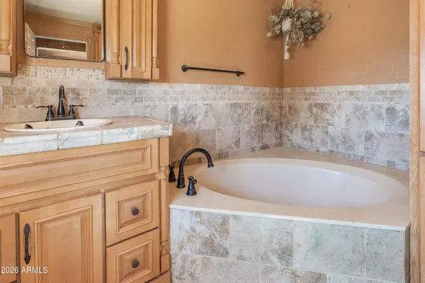 a bathroom with a bathtub and a sink