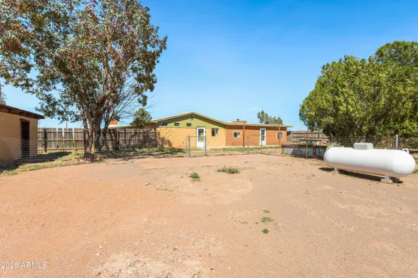 a house with trees in the background