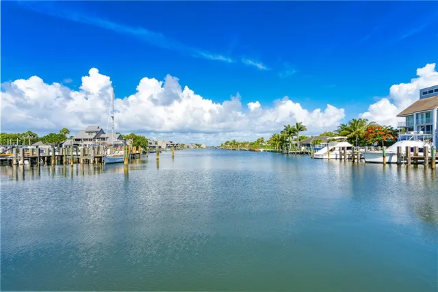 a view of a lake with a table and chairs