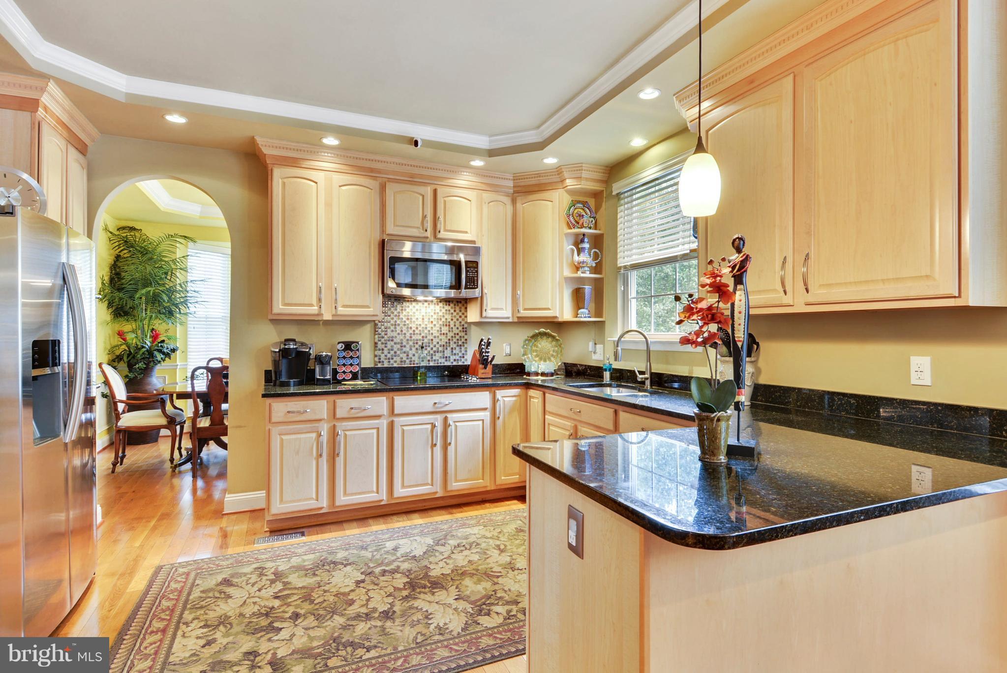 826 Swift Road Pasadena, MD 21122 - Photo 3 of 30 Kitchen has hardwood floors & under lighting.