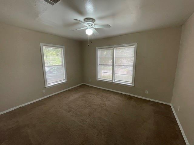 845 Rumfield Road White Settlement, TX 76108 - Photo 9 of 19 an empty room with windows and fan