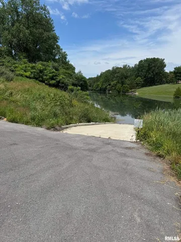 a view of a lake view with a big yard