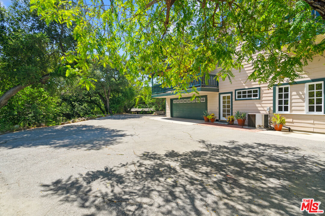 20912 Fontaine Road Topanga, CA 90290 - Photo 38 of 52 a front view of a house with a yard