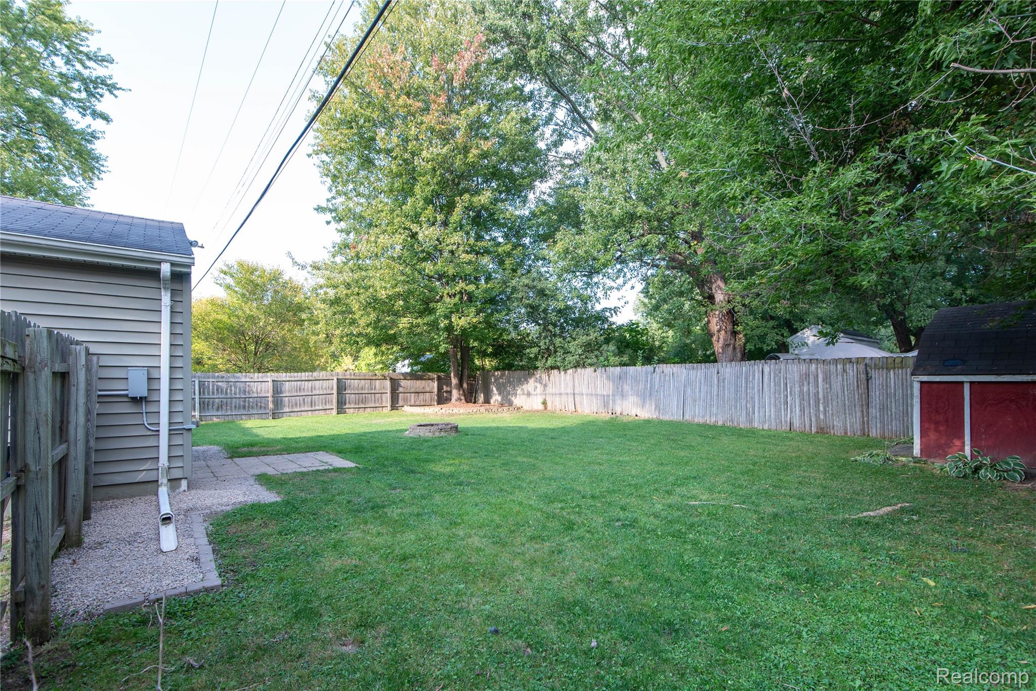 4034 Genesee Flint, MI 48506 - Photo 35 of 36 Fenced backyard with a shed