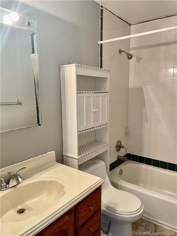 235 Cove Road, Unit 1 Stamford, CT 06902 - Photo 7 of 9 a bathroom with a sink a toilet and a bathtub
