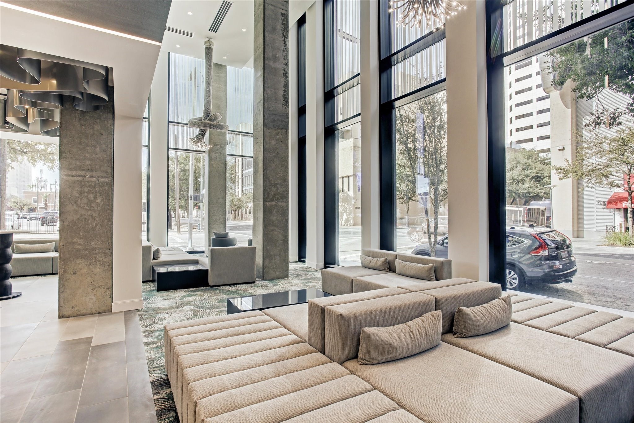 1211 Caroline Street, Unit 1007 Houston, TX 77002 - Photo 18 of 46 a living room with furniture and a large window