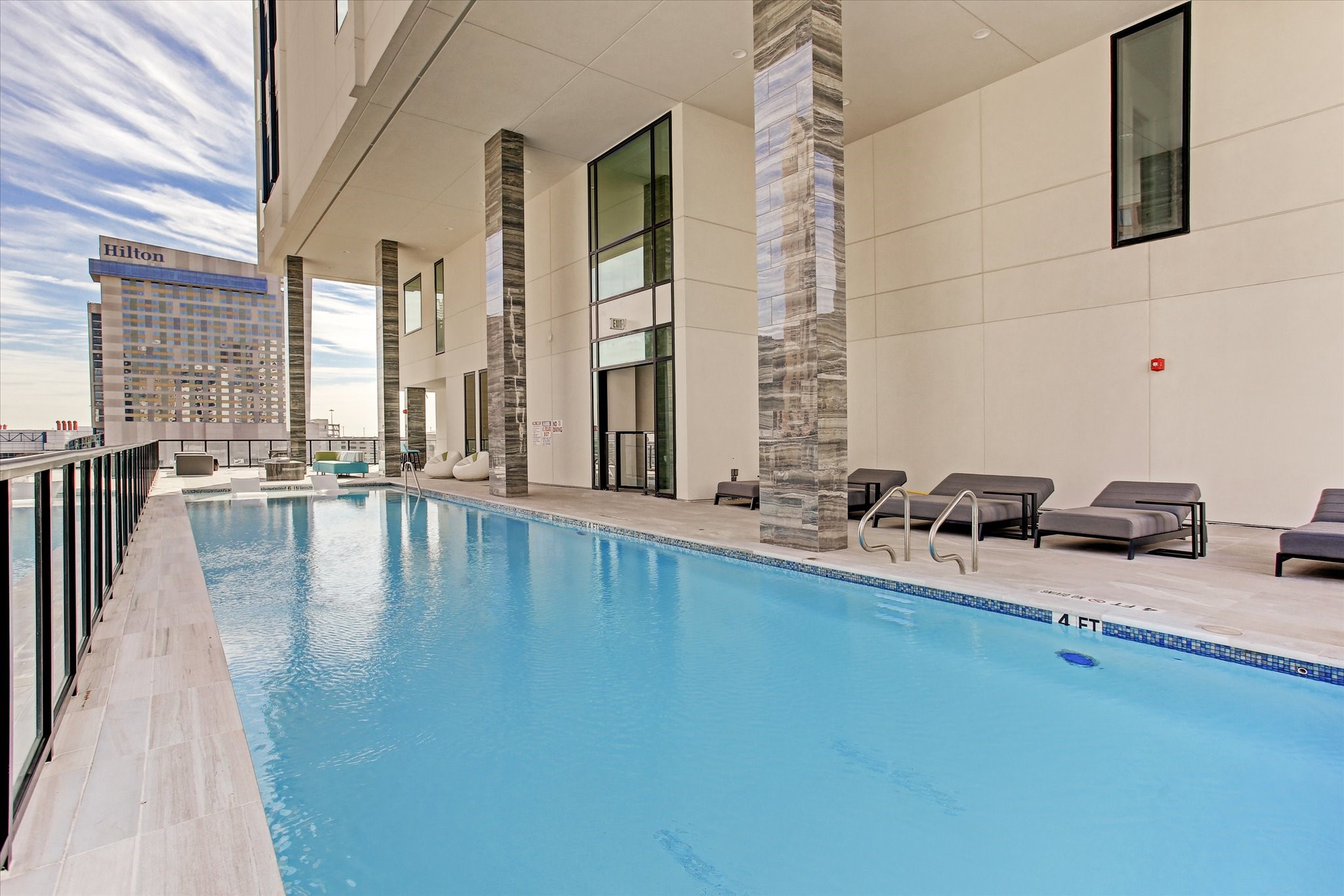 1211 Caroline Street, Unit 1007 Houston, TX 77002 - Photo 24 of 46 a swimming pool with outdoor seating and yard