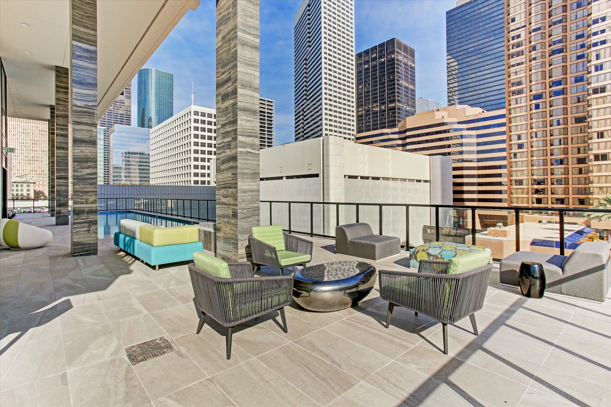 1211 Caroline Street, Unit 1007 Houston, TX 77002 - Photo 27 of 46 a view of a chairs and table in the back yard of the house