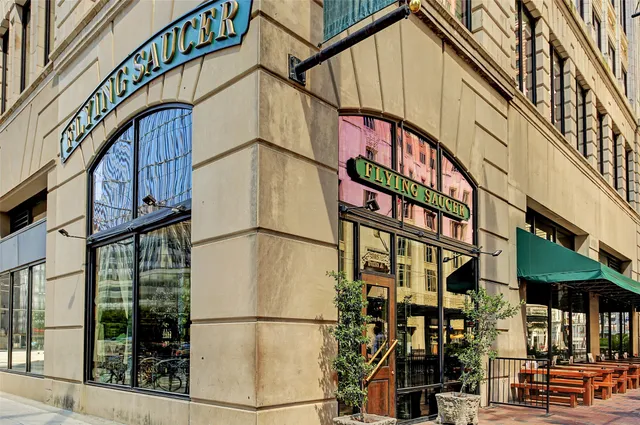 a view of a food market with retail shops