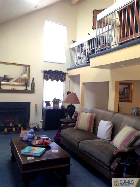 7 Spencer Street Somerset, NJ 08873 - Photo 14 of 21 a living room with furniture and a fireplace