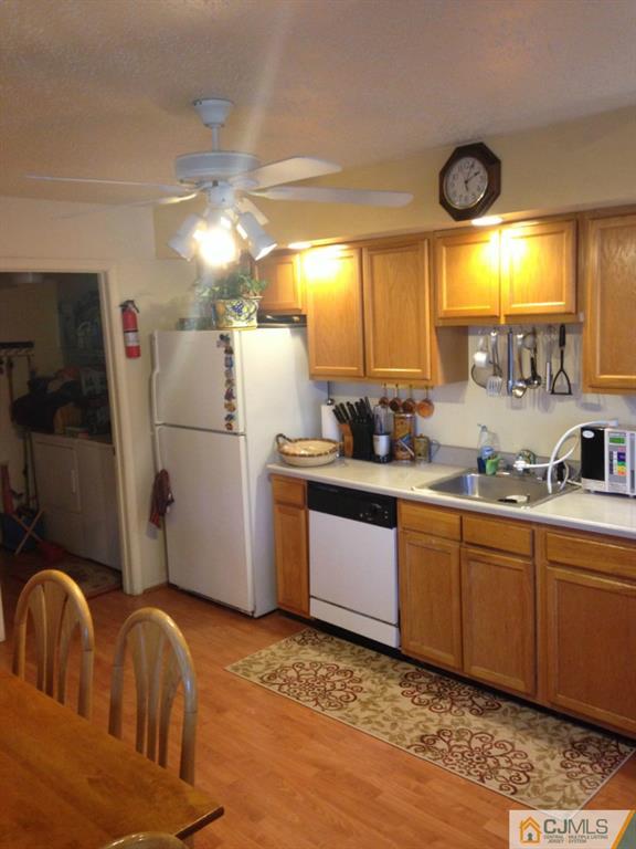 7 Spencer Street Somerset, NJ 08873 - Photo 15 of 21 a kitchen with refrigerator a sink and a large window
