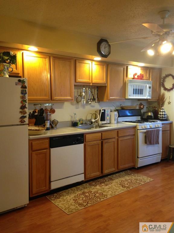 7 Spencer Street Somerset, NJ 08873 - Photo 16 of 21 a kitchen with stainless steel appliances granite countertop a sink and a stove