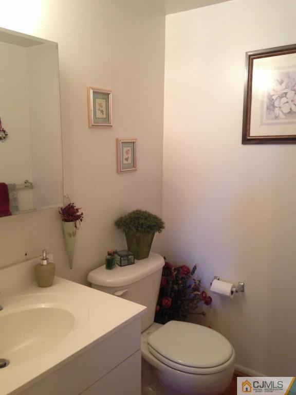 7 Spencer Street Somerset, NJ 08873 - Photo 21 of 21 a white toilet sitting next to a bathroom sink