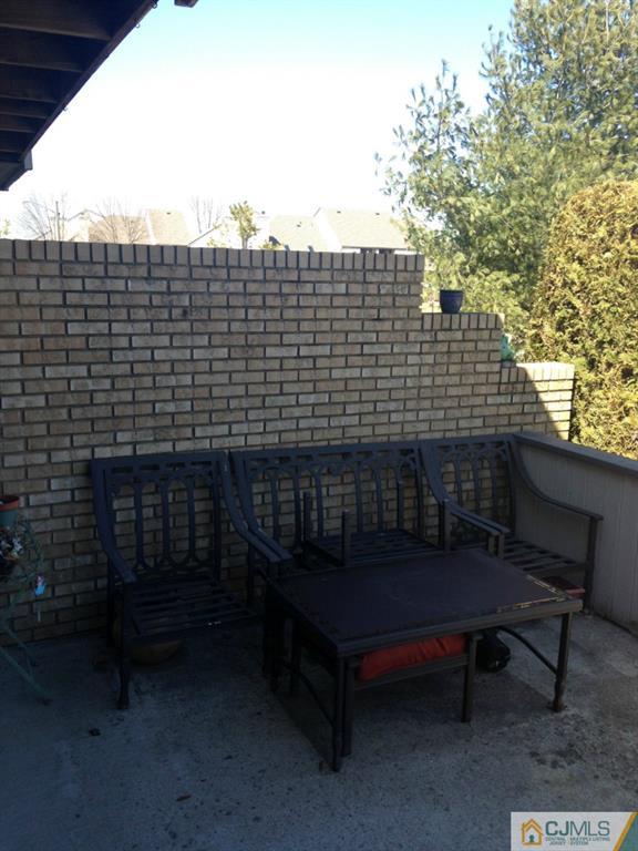 7 Spencer Street Somerset, NJ 08873 - Photo 6 of 21 a balcony with wooden bench and bench