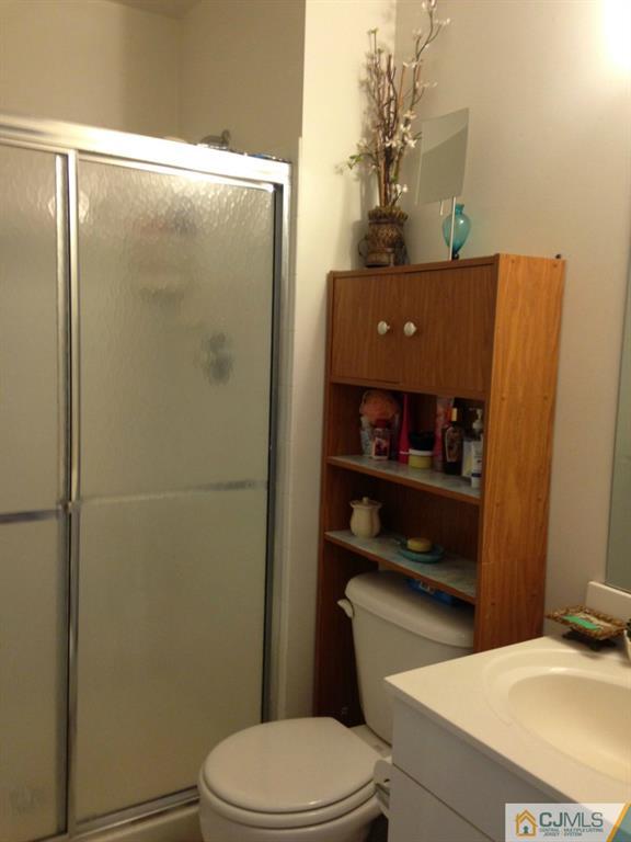 7 Spencer Street Somerset, NJ 08873 - Photo 9 of 21 a bathroom with a toilet and a shower