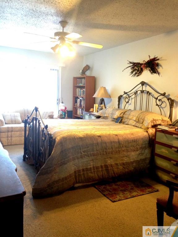 7 Spencer Street Somerset, NJ 08873 - Photo 10 of 21 a bedroom with a bed and cabinets