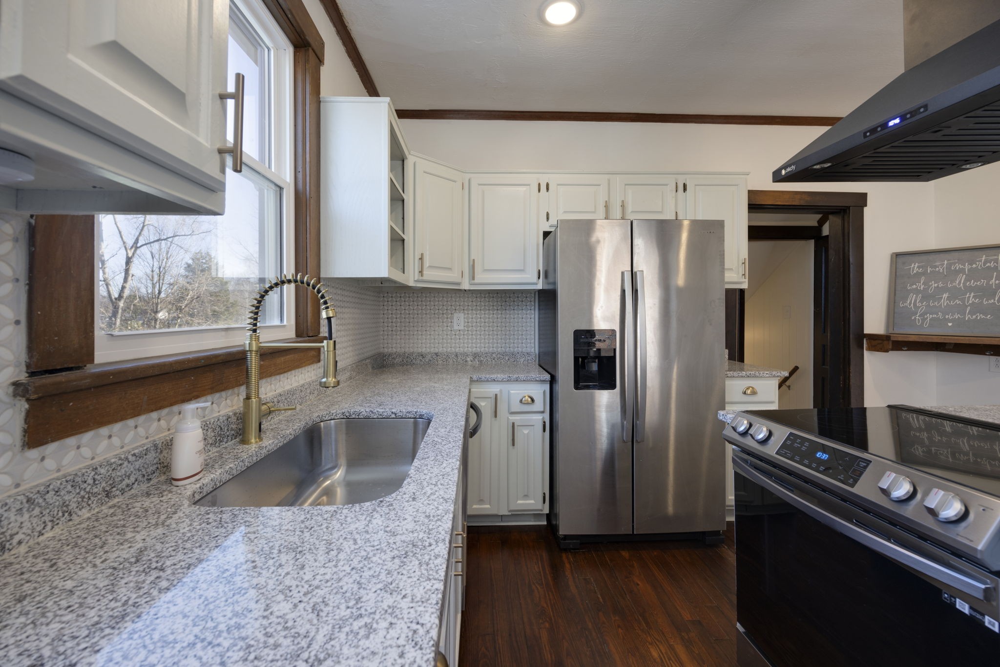 607 3rd Avenue West Springfield, TN 37172 - Photo 18 of 65 a kitchen with stainless steel appliances granite countertop a refrigerator and a sink
