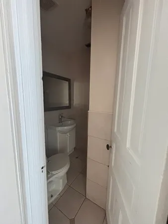 a bathroom with a toilet and a sink