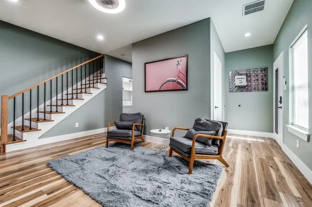 a living room with furniture and a rug