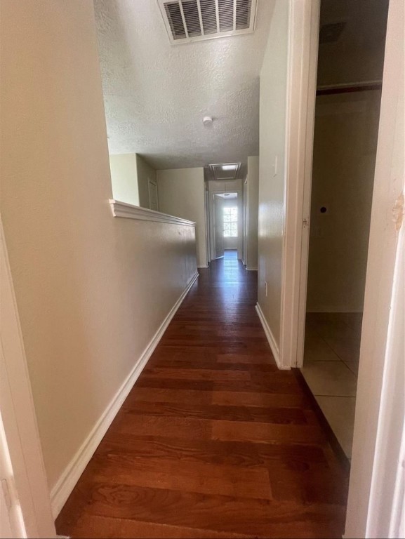 13064 Peppergate Lane Houston, TX 77044 - Photo 14 of 18 a view of a hallway with wooden floor